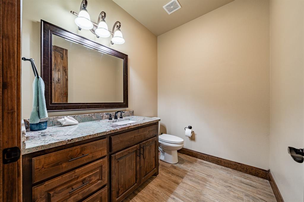 1032 Braune Road Merkel, TX 79536 - Photo 23 of 36 a bathroom with a toilet sink and mirror