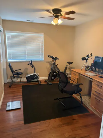 a living room with furniture pool table and a window