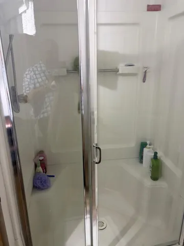 a bath room with a shower