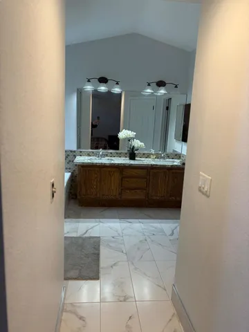 a view of living room with furniture and wooden floor