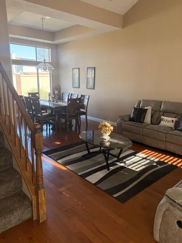 a table room with furniture and wooden floor