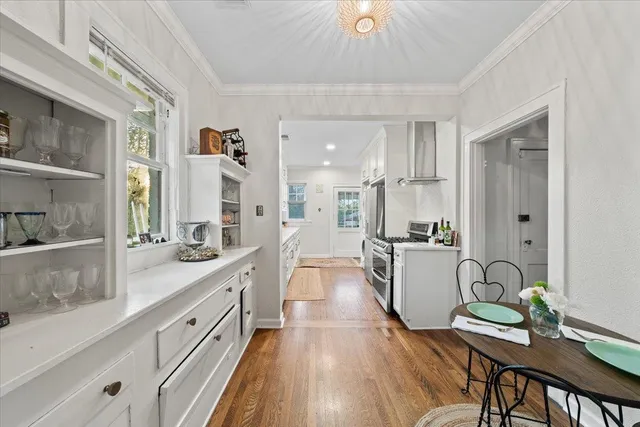 a large kitchen with a table and chairs