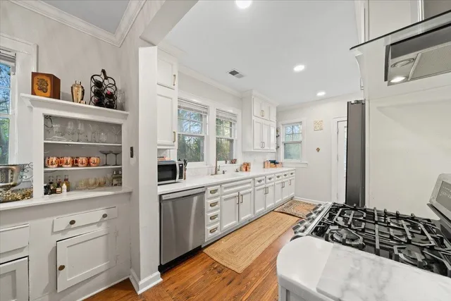 a kitchen with a sink and cabinets