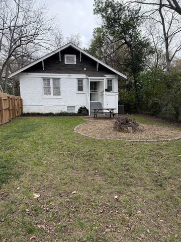 a front view of a house with a swimming pool