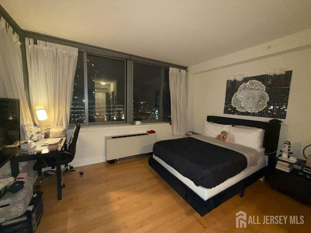 1 Spring Street, Unit 702 New Brunswick, NJ 08901 - Photo 9 of 10 a living room with furniture