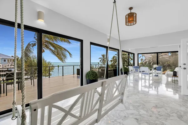 a view of a dinning table and chairs in patio