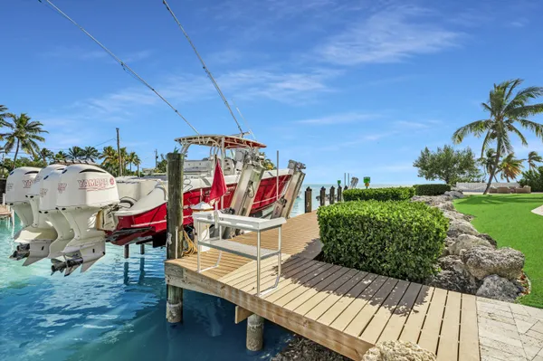 a view of a backyard and swimming pool