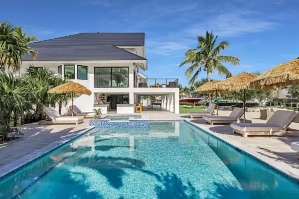 a large window with lawn chairs