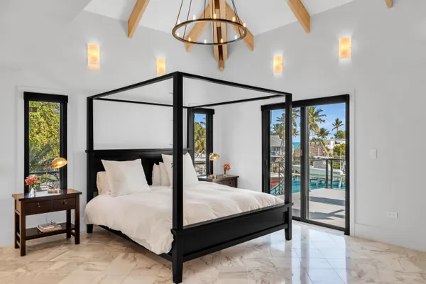 a bathroom with a bathtub sink and mirror