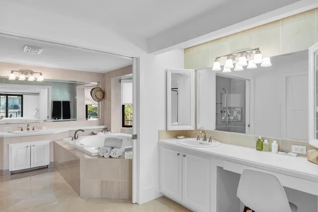 a bathroom with a toilet a sink and a mirror