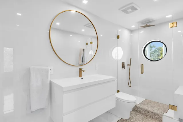 a bedroom with two beds and a window