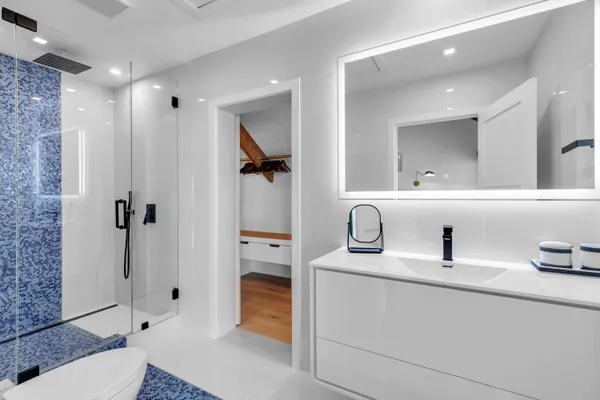 a balcony with furniture and a potted plant