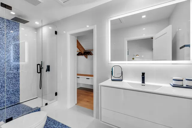 a balcony with furniture and a potted plant