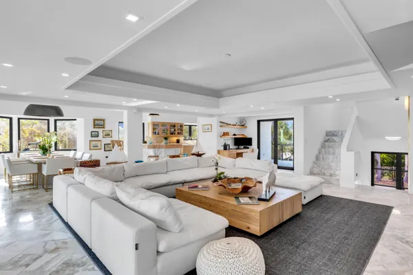 a living room with furniture and a table