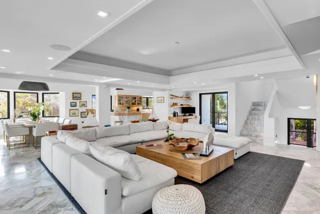 a living room with furniture and a table