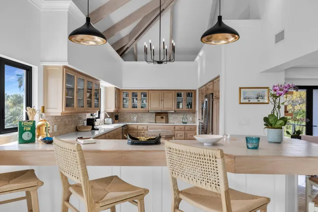 a kitchen with a table and chairs