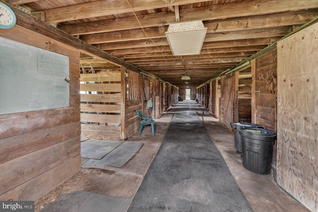 158 Chesterfield Georgetown Road Chesterfield, NJ 08515 - Photo 39 of 48 Spacious barn corridor with rustic charm.