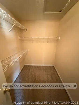 a view of an empty walk in closet