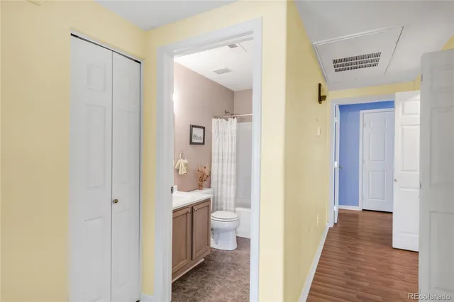 a view of a bathroom from a hallway