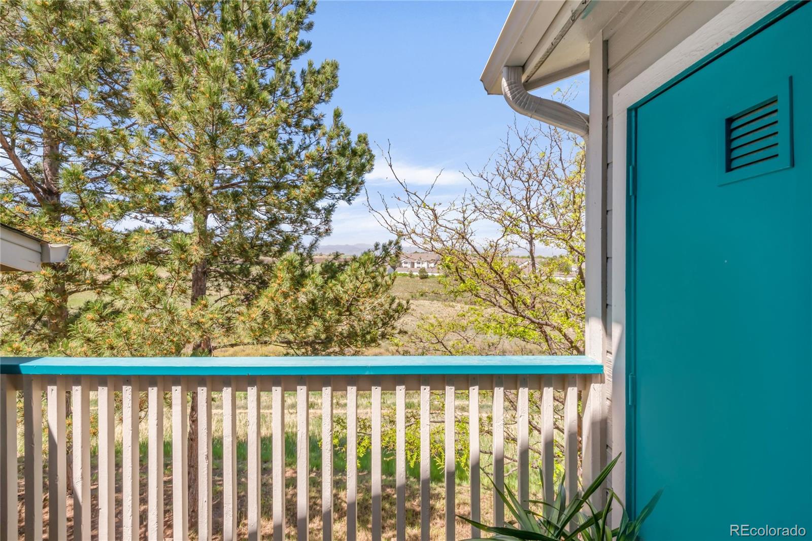 8405 Pebble Creek Way, Unit 202 Highlands Ranch, CO 80126 - Photo 22 of 27 a view of a street from a balcony