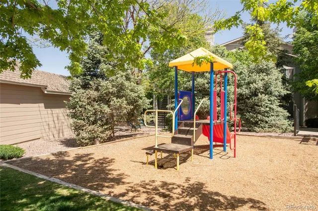 a view of a park with slide and a slide