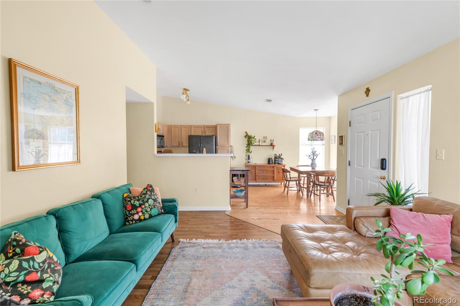 8405 Pebble Creek Way, Unit 202 Highlands Ranch, CO 80126 - Photo 6 of 27 a living room with furniture and flowers