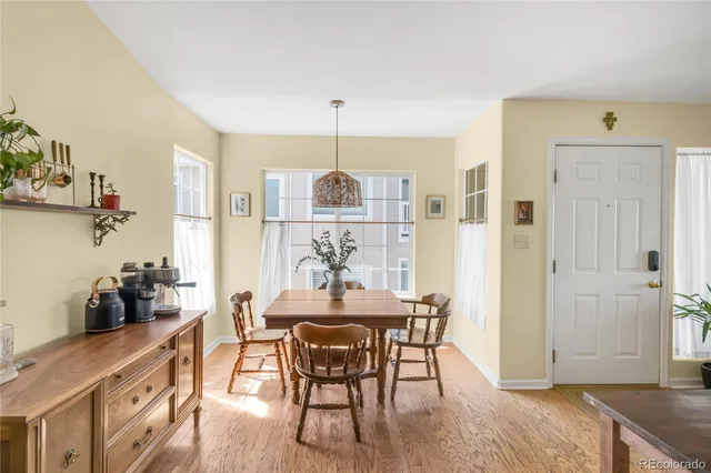 a view of a dining room with furniture and wooden floor