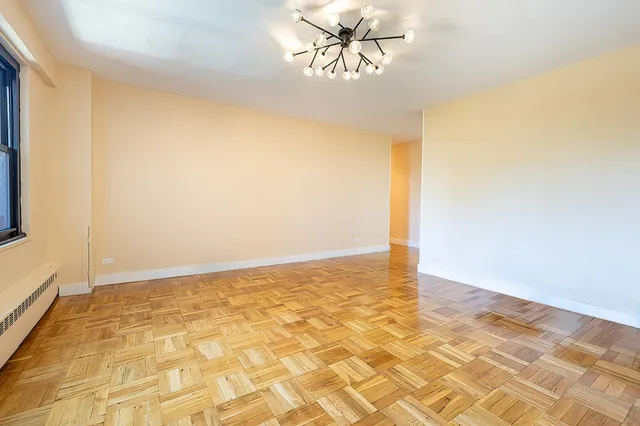 a picture of a bench in front of gate