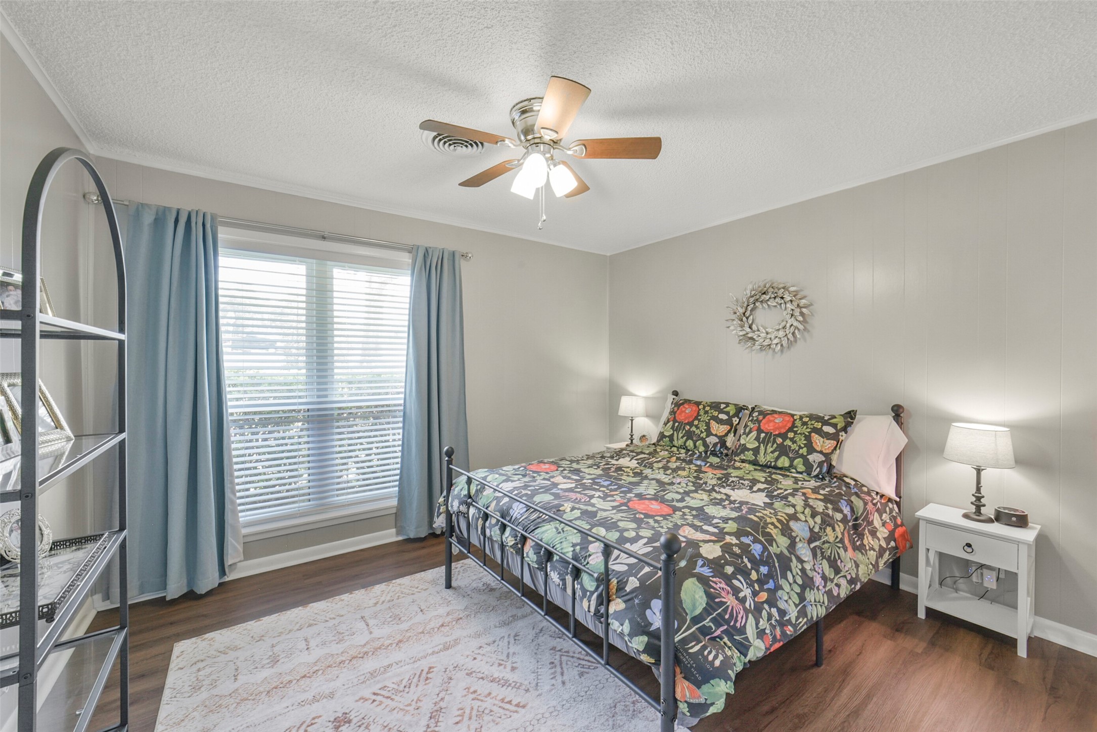10313 South Williams Road Conroe, TX 77303 - Photo 30 of 48 Bedroom #3 with ceiling fan, large windows, and vinyl plank flooring.