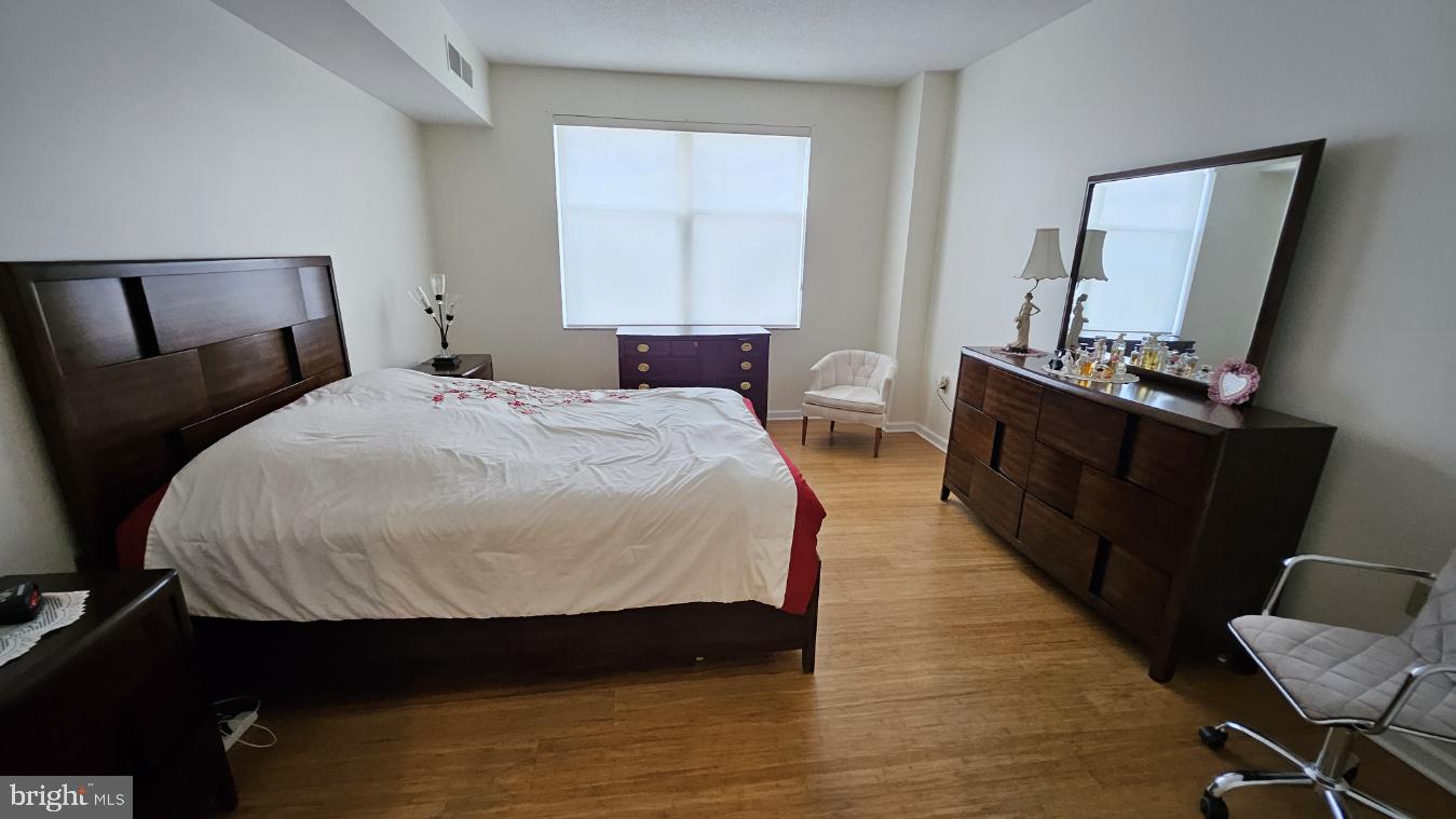 3801 Canterbury Road, Unit 409 Baltimore, MD 21218 - Photo 10 of 31 Bright and airy bedroom retreat.