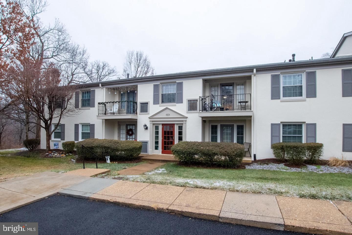 8354 G Dunham Court, Unit 655 Springfield, VA 22152 - Photo 1 of 19 a front view of a house with a garden