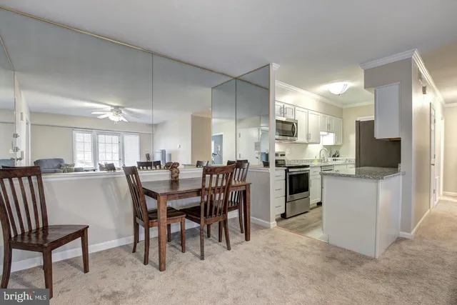 a view of a dining room kitchen and a window