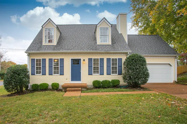 front view of a house with a yard
