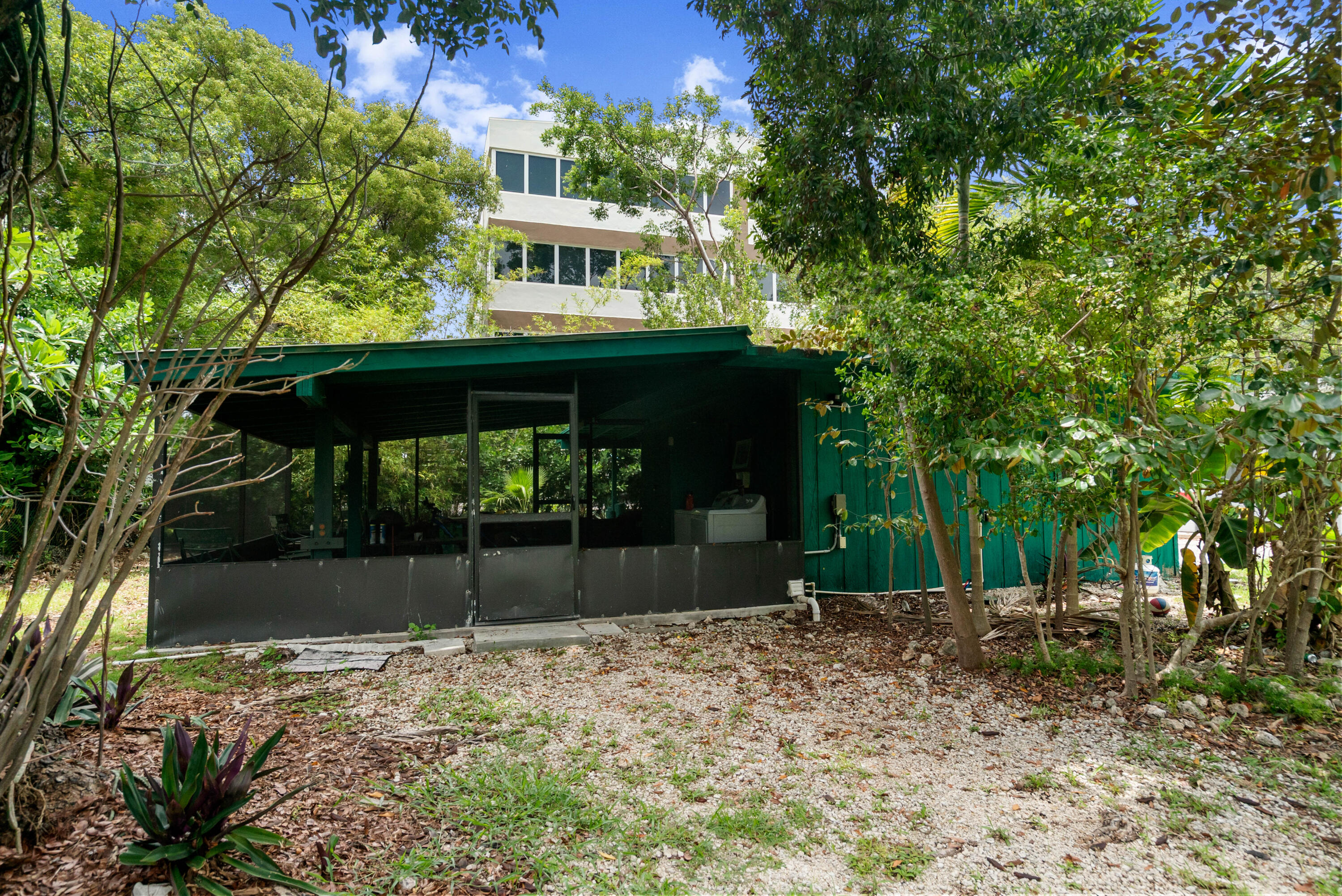 227 Atlantic Boulevard Key Largo, FL 33037 - Photo 23 of 35 Screened in porch from storage building