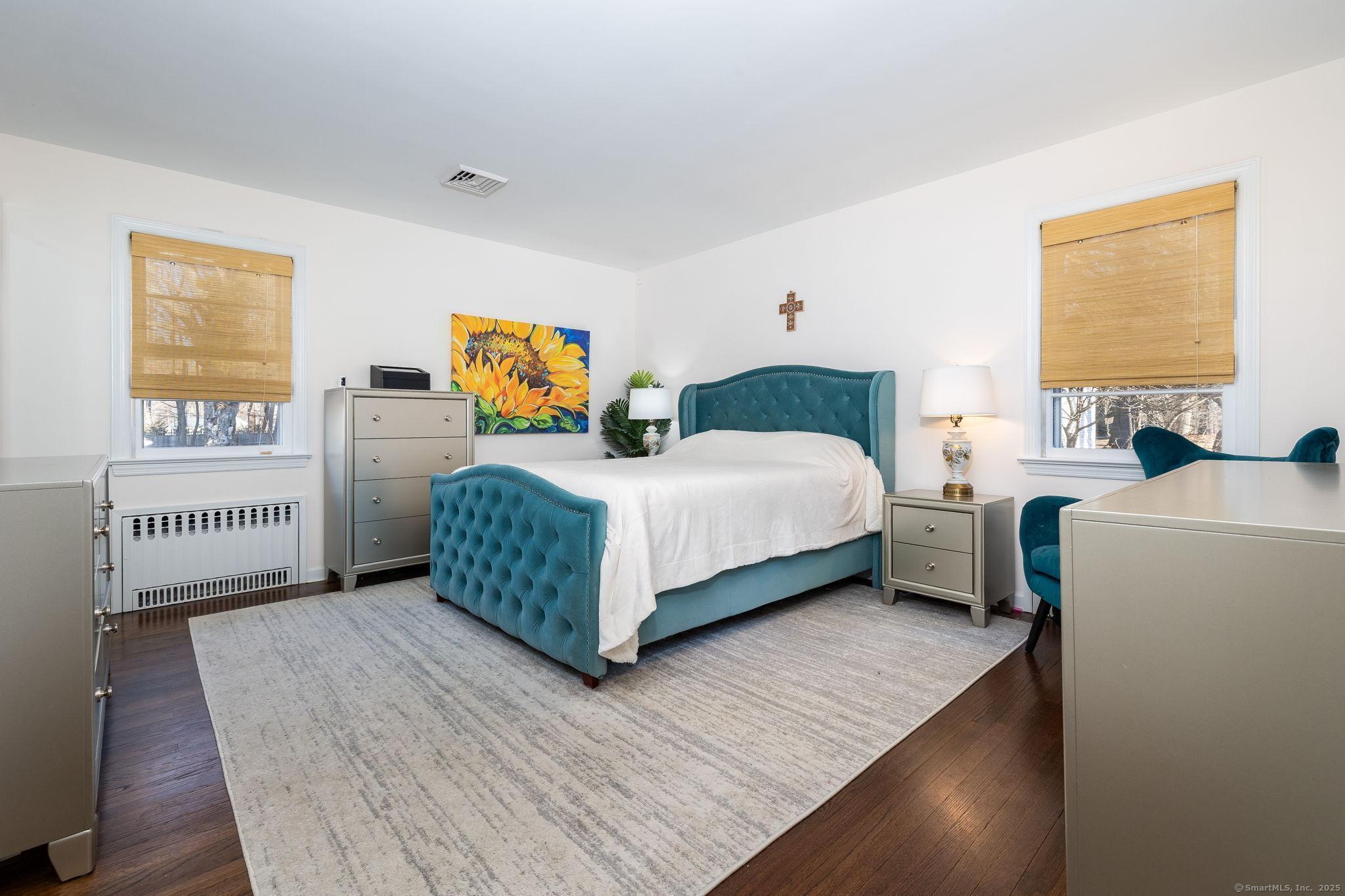 2 Columbine Lane Norwalk, CT 06851 - Photo 13 of 33 a bedroom with a bed table and a window