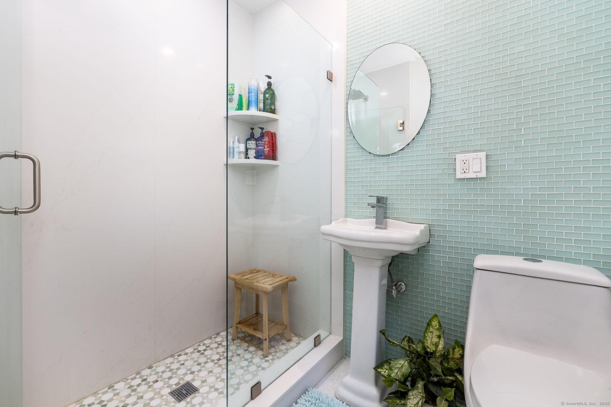 2 Columbine Lane Norwalk, CT 06851 - Photo 14 of 33 a bathroom with a sink toilet and a mirror