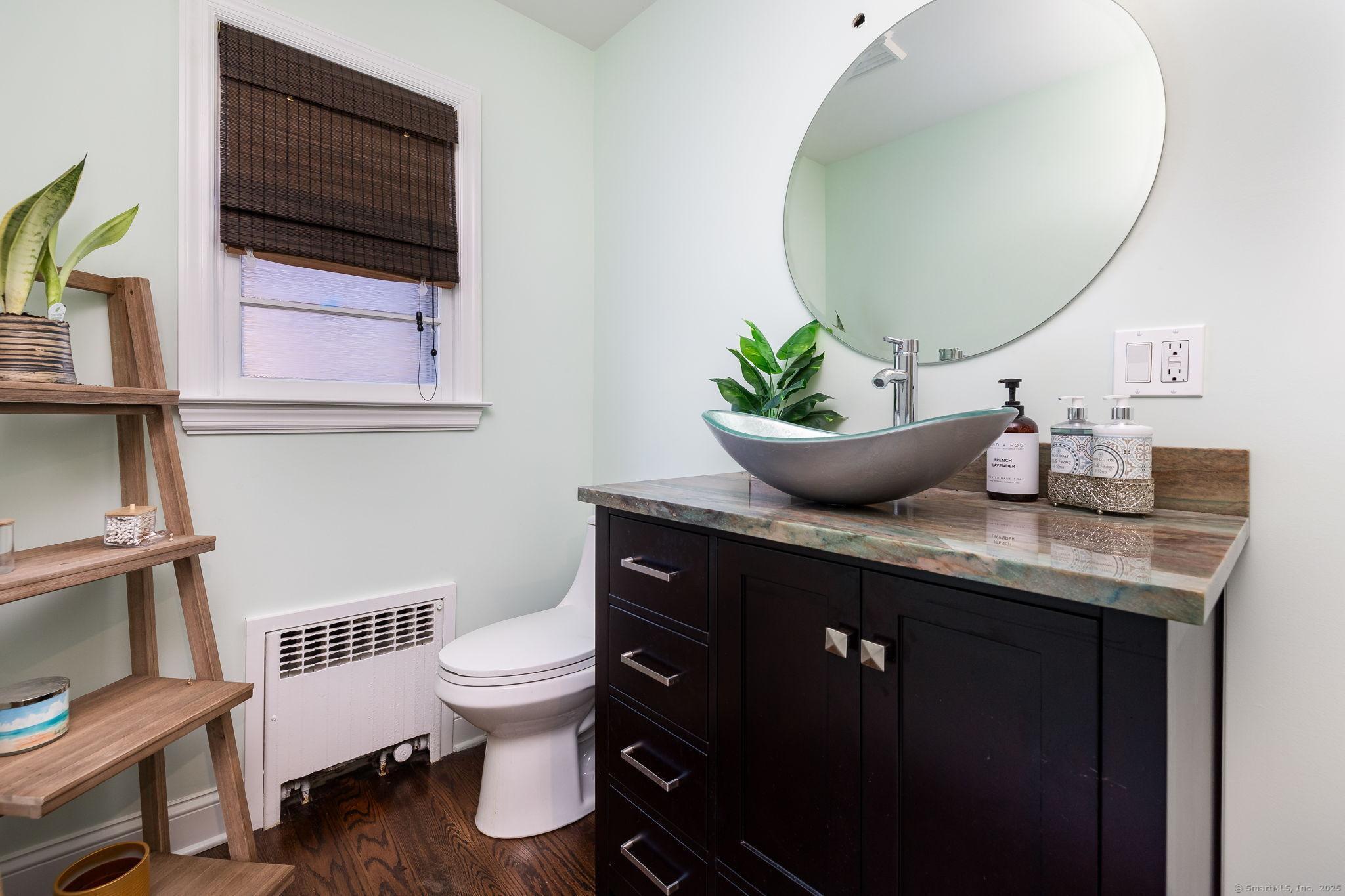 2 Columbine Lane Norwalk, CT 06851 - Photo 16 of 33 a bathroom with a granite countertop toilet sink and mirror
