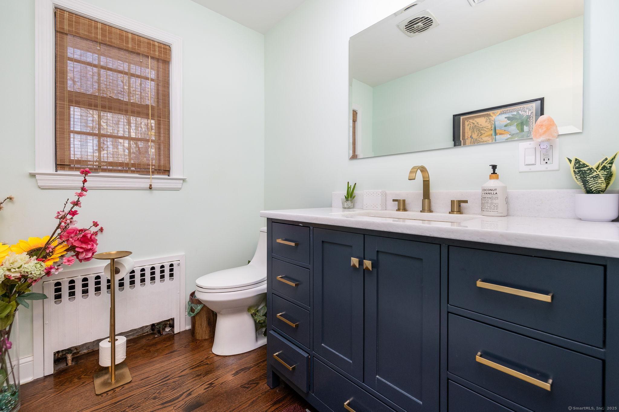 2 Columbine Lane Norwalk, CT 06851 - Photo 20 of 33 a bathroom with a sink mirror and toilet