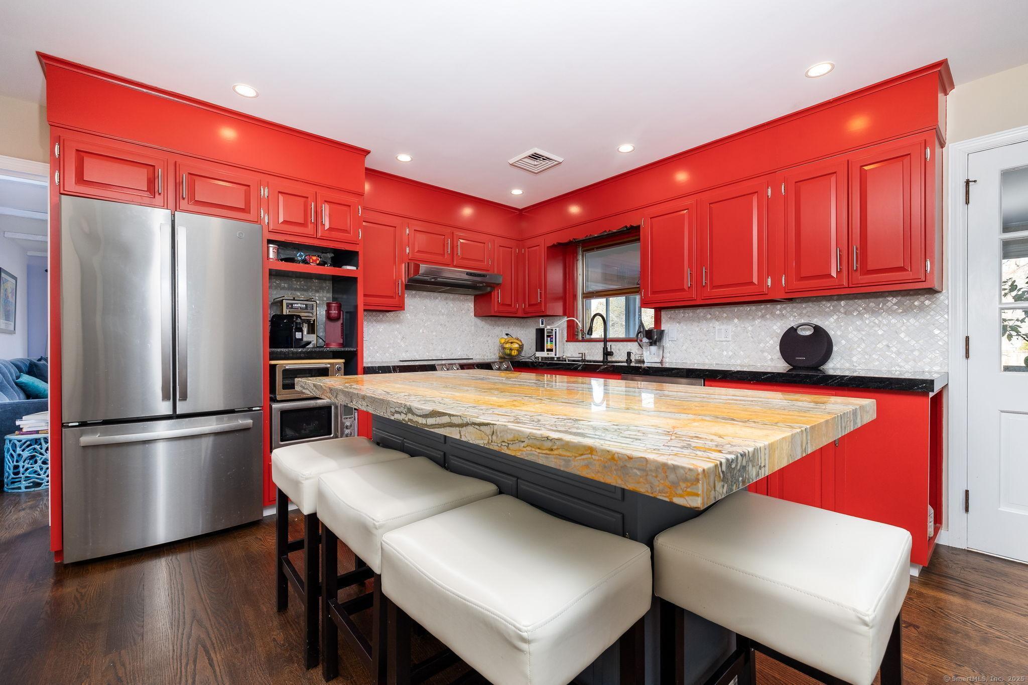 2 Columbine Lane Norwalk, CT 06851 - Photo 2 of 33 a kitchen with stainless steel appliances granite countertop a refrigerator a sink and a stove
