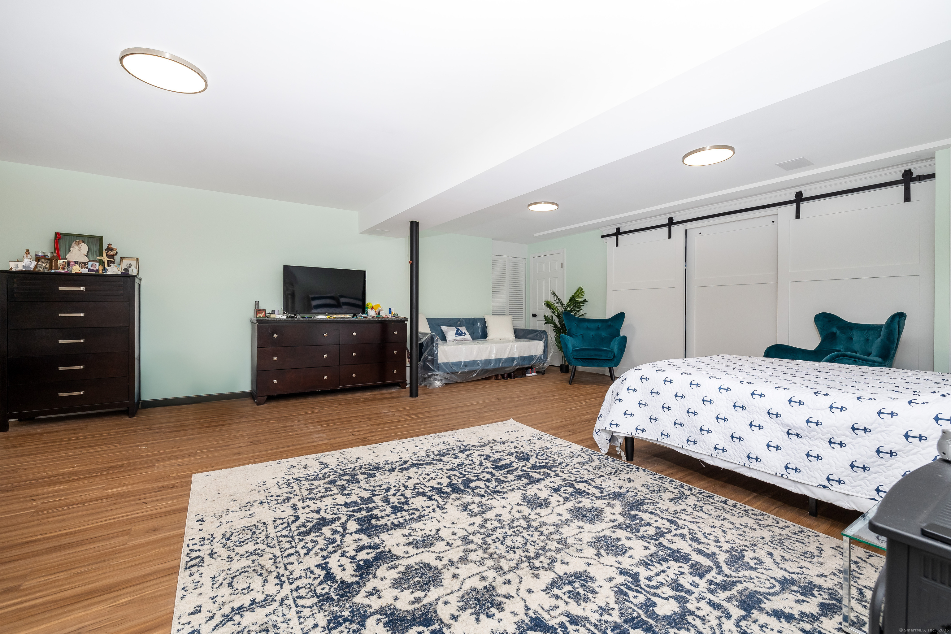 2 Columbine Lane Norwalk, CT 06851 - Photo 25 of 33 a bedroom with a bed and a television