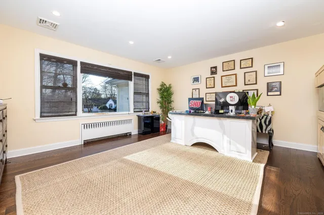 a bedroom with furniture and window