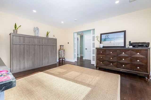 a bedroom with a bed and a dresser