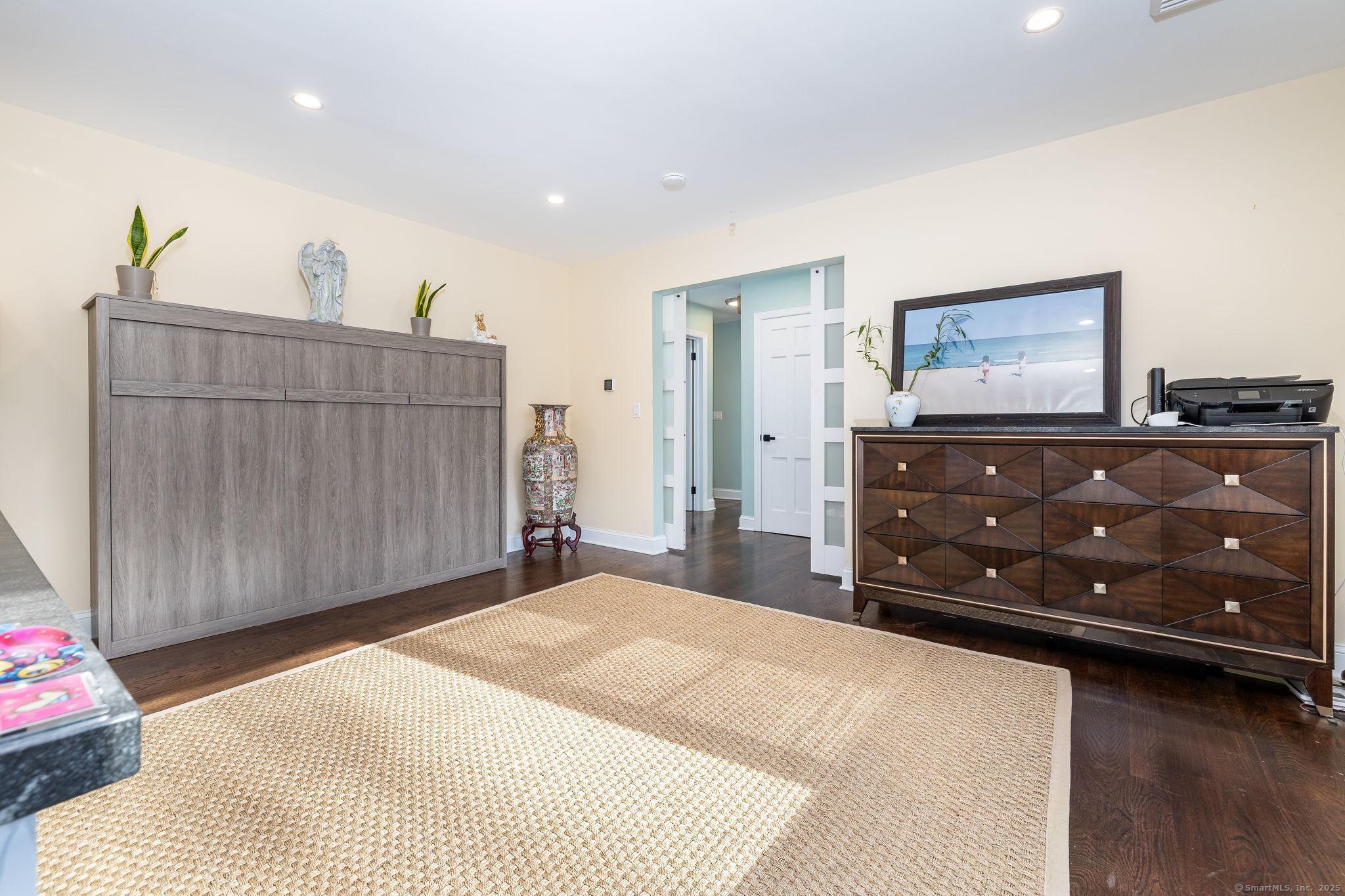 2 Columbine Lane Norwalk, CT 06851 - Photo 9 of 33 a bedroom with a bed and a dresser
