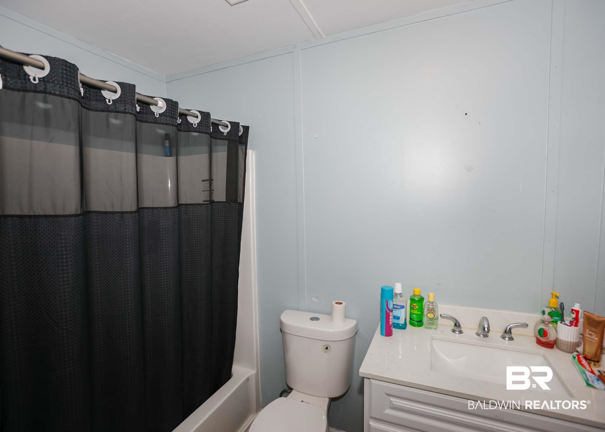 11998 Workman Avenue Foley, AL 36535 - Photo 20 of 59 Full bathroom featuring vanity and shower / tub combo with curtain