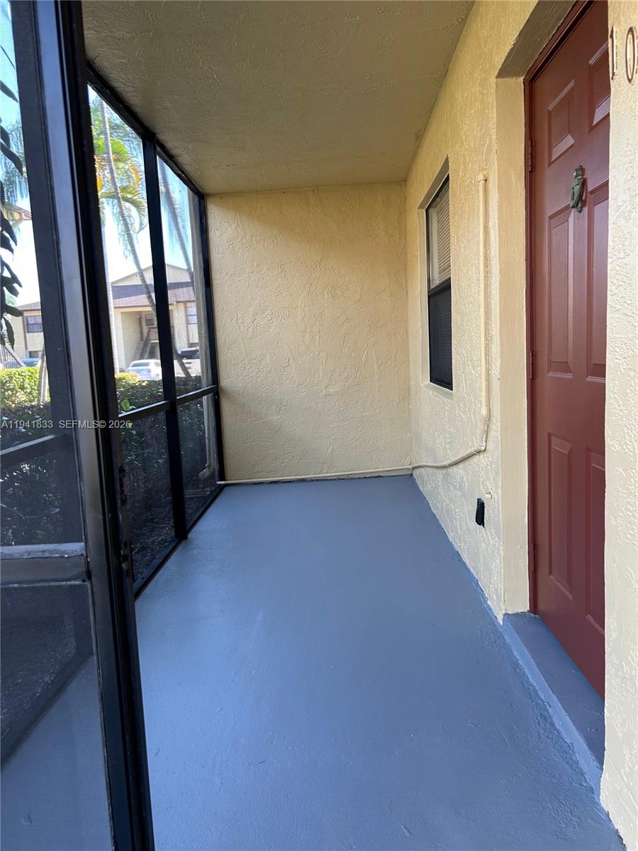 10027 Winding Lake Road, Unit 103 Sunrise, FL 33351 - Photo 11 of 11 a view of an empty room