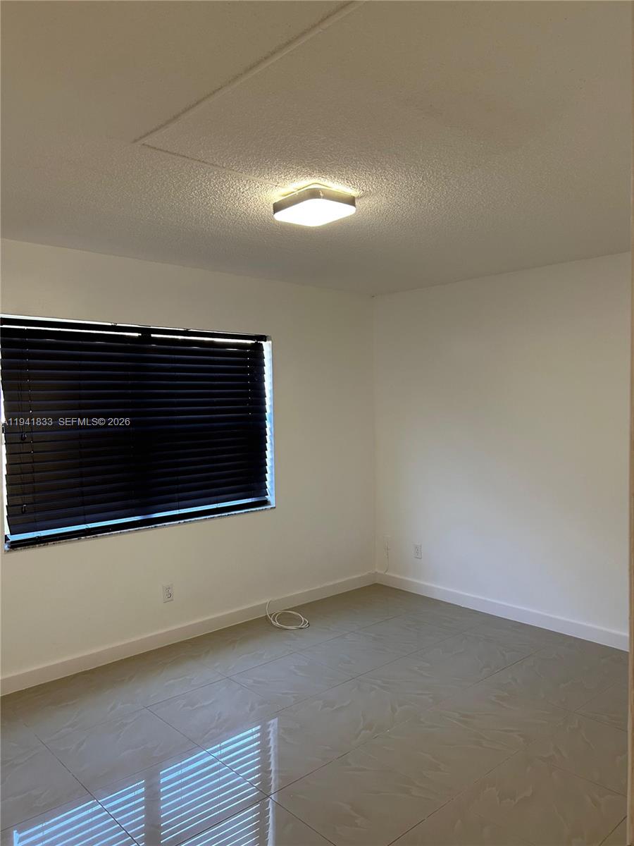 10027 Winding Lake Road, Unit 103 Sunrise, FL 33351 - Photo 5 of 11 a view of a room