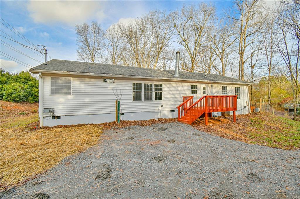 5203 Elrod Road Gainesville, GA 30506 - Photo 1 of 1 a view of a house with backyard and trees