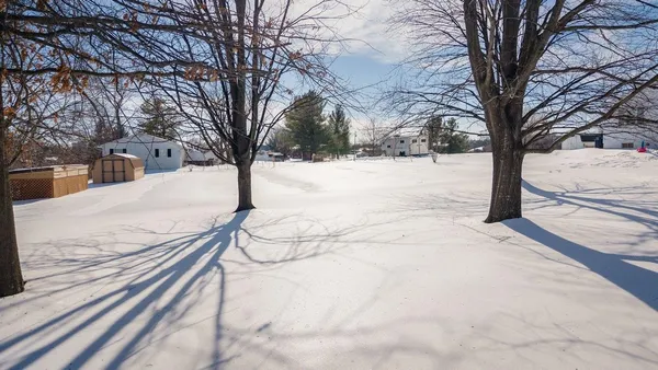 a view of snow on the side of road