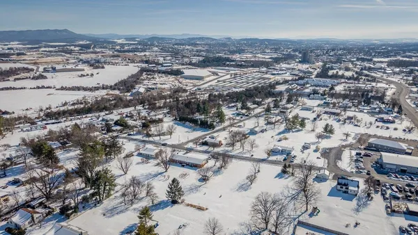 an aerial view of residential house and parking space