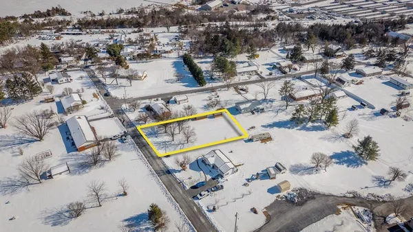 a view of a yard covered with snow